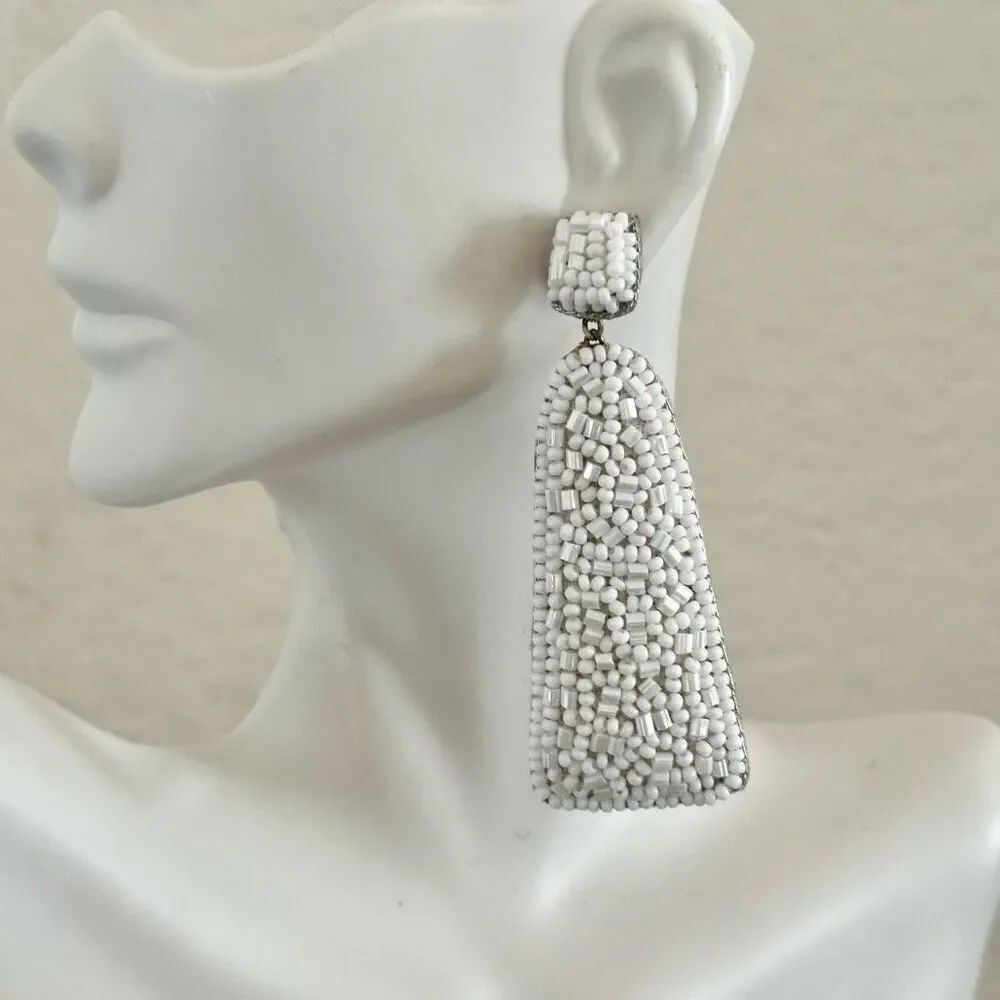 White beaded statement earrings